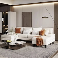 a modern living room with a white sectional sofa